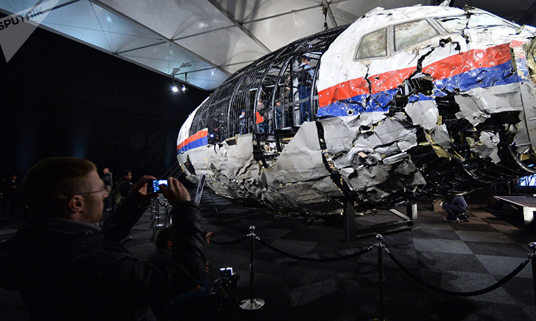Dutch to put four people on trial for murder over Malaysia Airlines flight MH17 crash