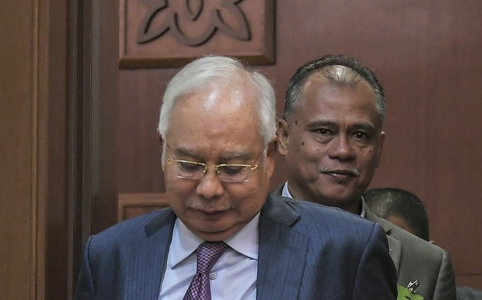 Najib ordered to defend all seven charges against him in SRC case