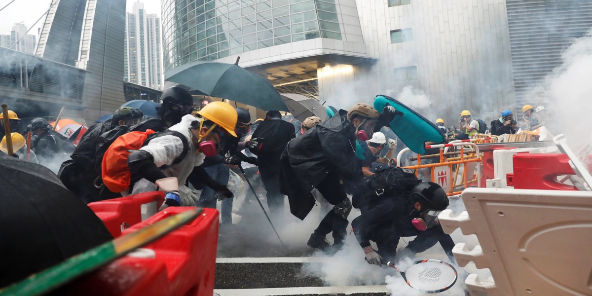 Hong Kong police fire tear gas as protesters defy rally ban