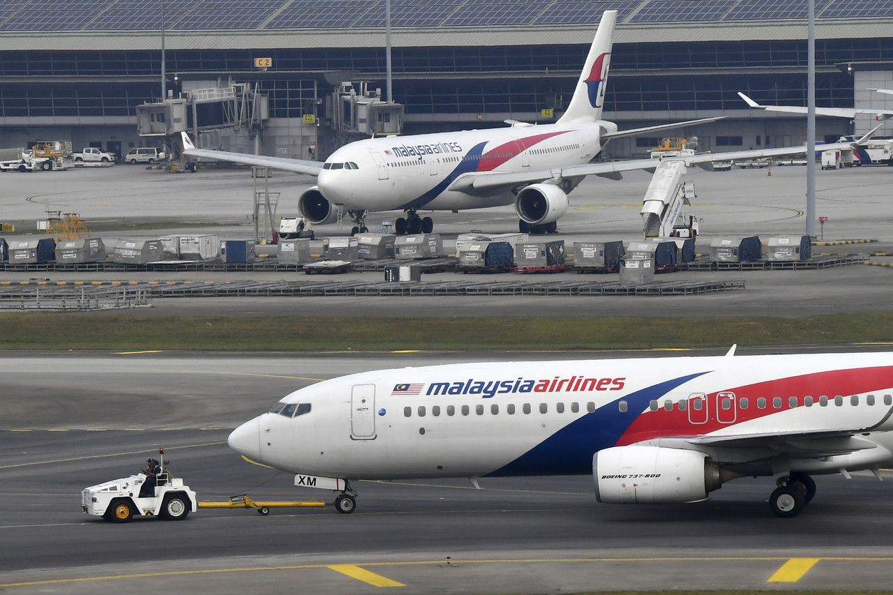 Malaysia Airlines enforces use of face masks on passengers