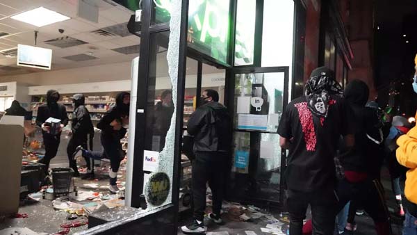 US unrest: New York under curfew as looters hit luxury stores