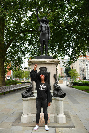 Statue of UK slave merchant replaced with Black Lives Matter protester