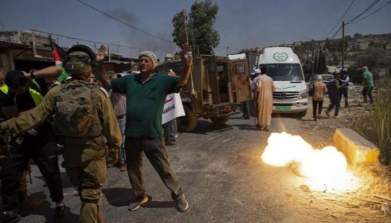 Dozens of Palestinian protesters injured in clashes with Israeli soldiers in West Bank: medics