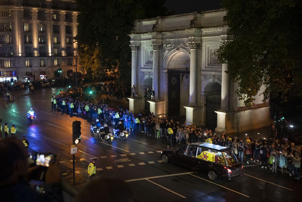 Queen’s coffin arrives at Buckingham Palace as huge crowds line London route