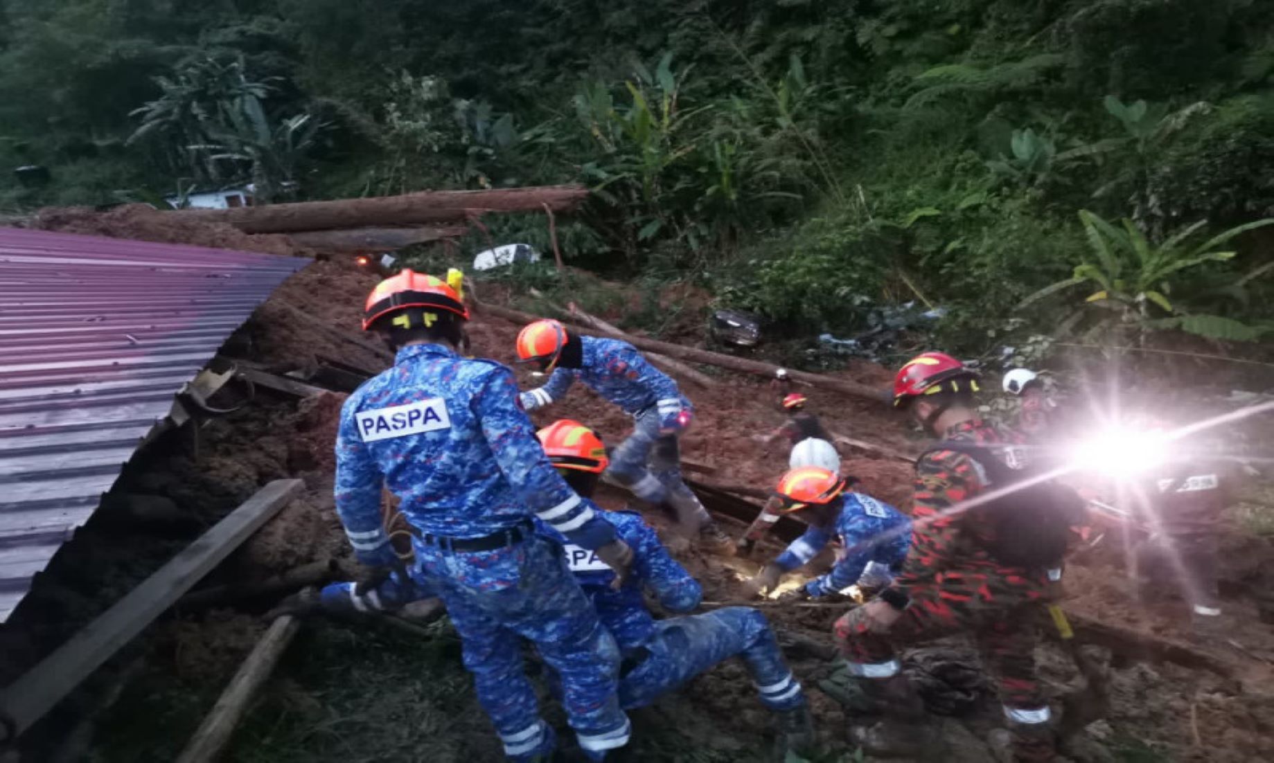 13 Dead, Dozens Trapped In Malaysian Landslide