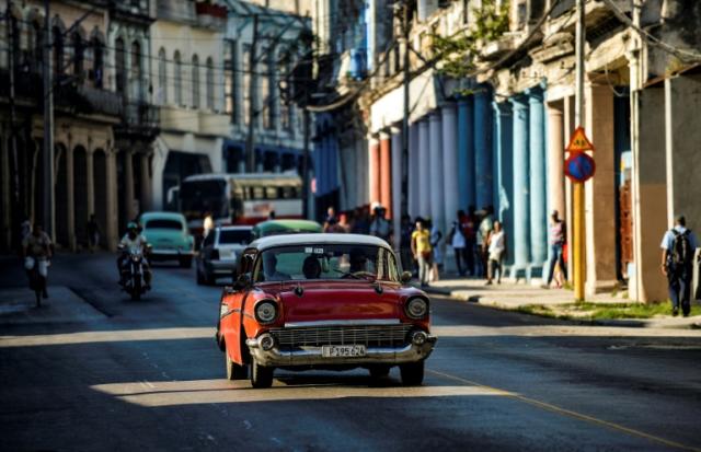 Cuba puts state-owned car owners on commuter aid duty