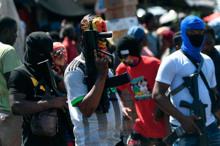 About 70 dead in Haiti gang clashes; 24,000 repatriated from Dominican Republic