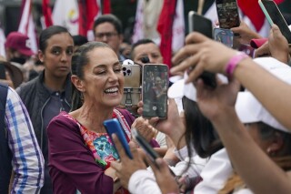 Mexico’s leading presidential candidate stopped by masked men who ask for help in stemming violence