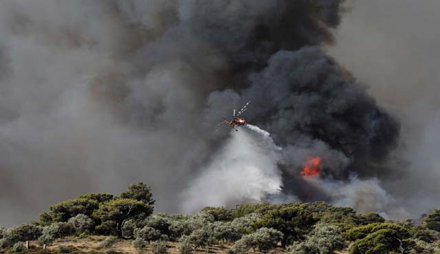 Fires near Athens under control as new blazes rage in Greece