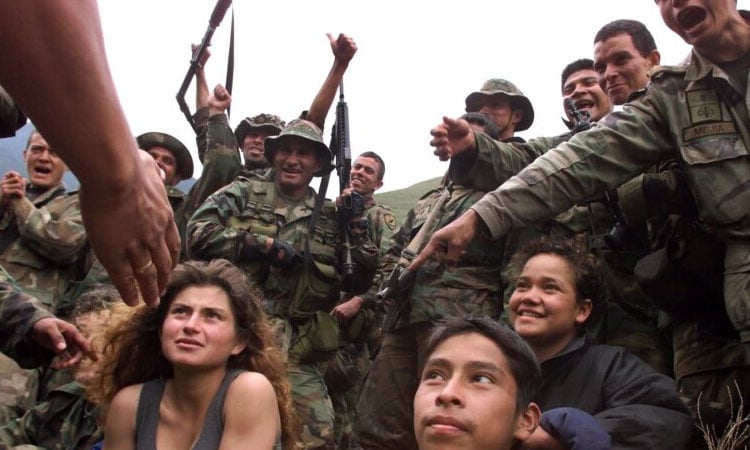 Colombia: Young woman mourns kidnapped teen brother killed by military bombing of guerilla outpost